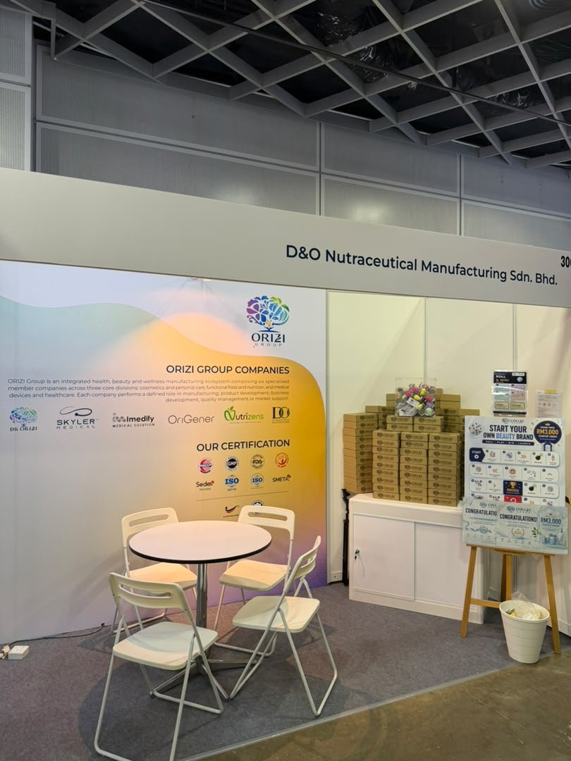 ORIZI Group companies and certifications wall with meeting table at booth 3008, D and O Nutraceutical Manufacturing fascia, Cosmobeaute 2026