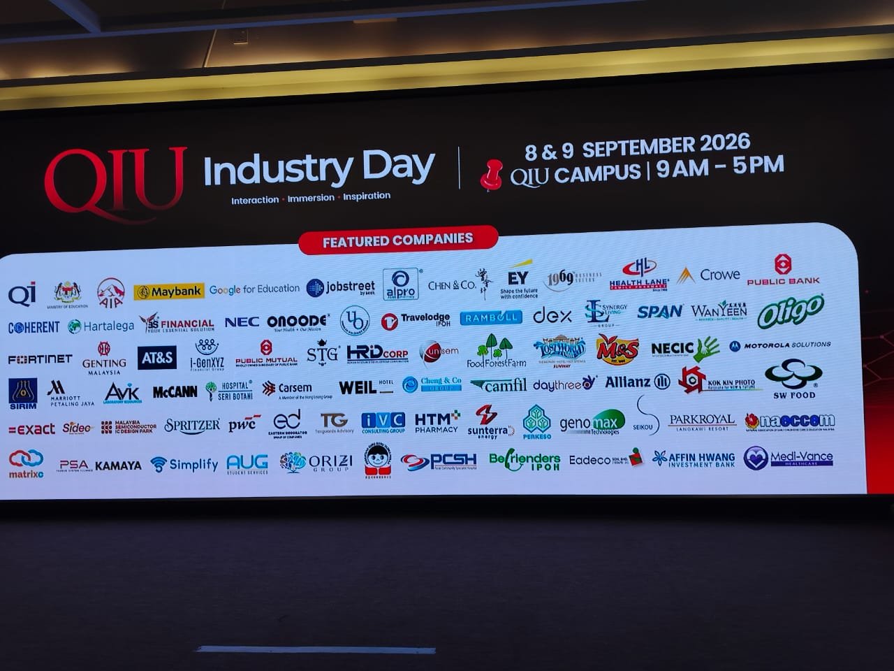 QIU Industry Day 2026 featured companies board including the ORIZI Group logo