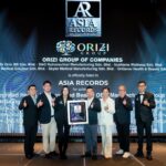 The ORIZI Group team on stage with the ASIA Records certificate, 20 October 2026.