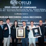 ORIZI Group team holding the ASEAN Records and ASIA Records certificates, 20 October 2026